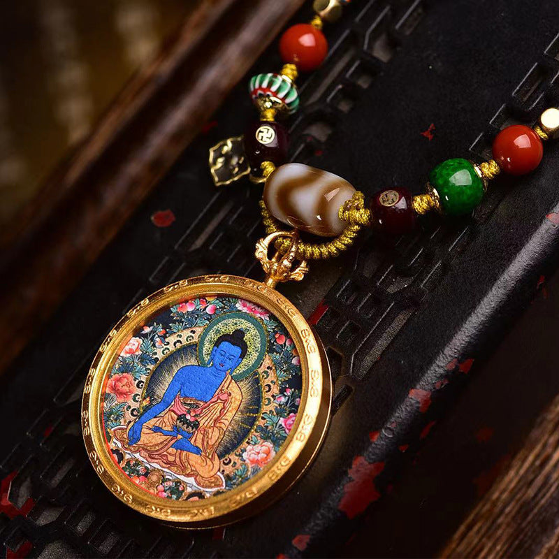 Tibetan Medicine Buddha Thangka Necklace: Hand-Painted Gold-Plated Masterpiece